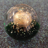 Golden Orb Over Emerald Glass Paperweight #38